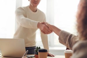 shaking hands in a business setting